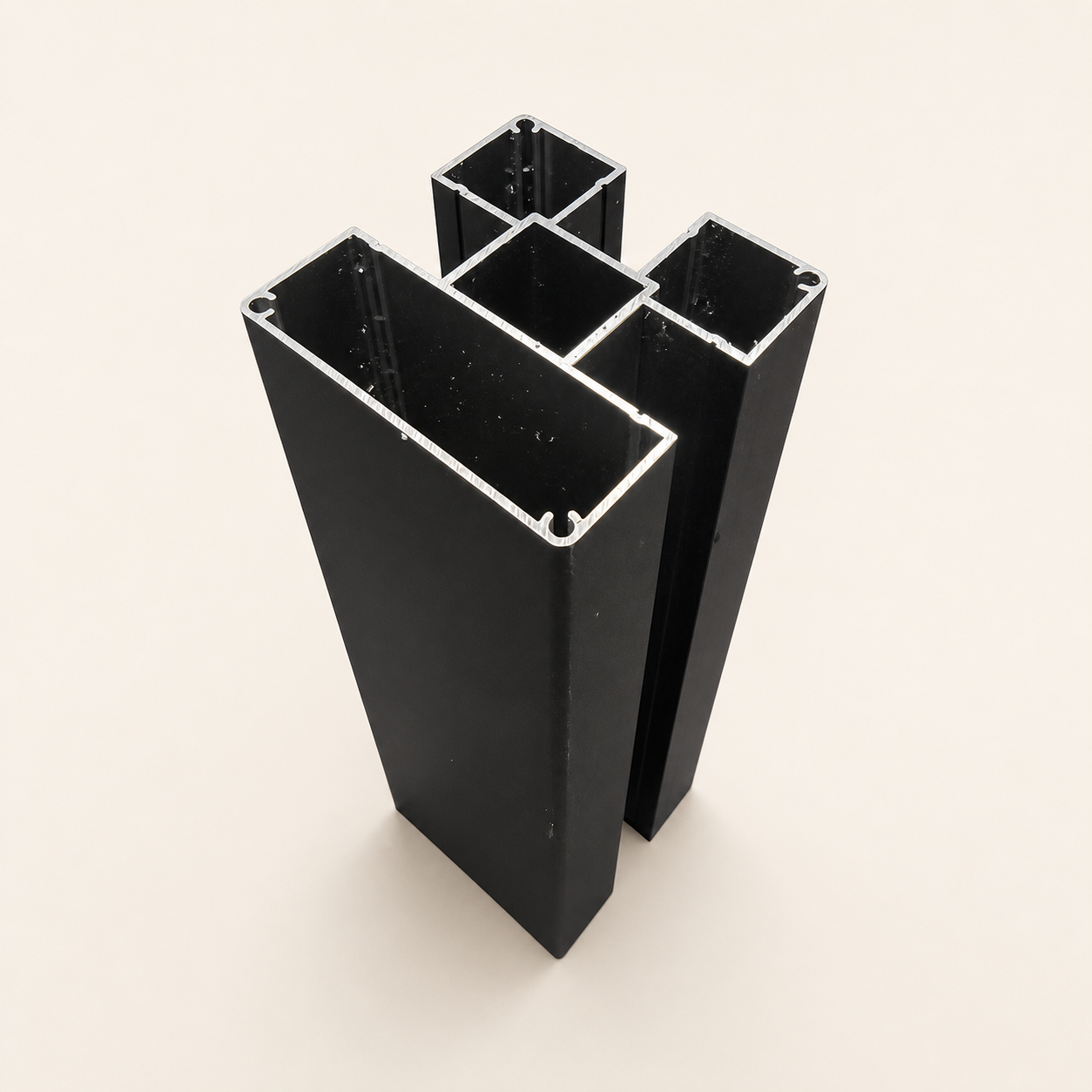 Three-inch black aluminum Compoxen fence post on a warm studio background