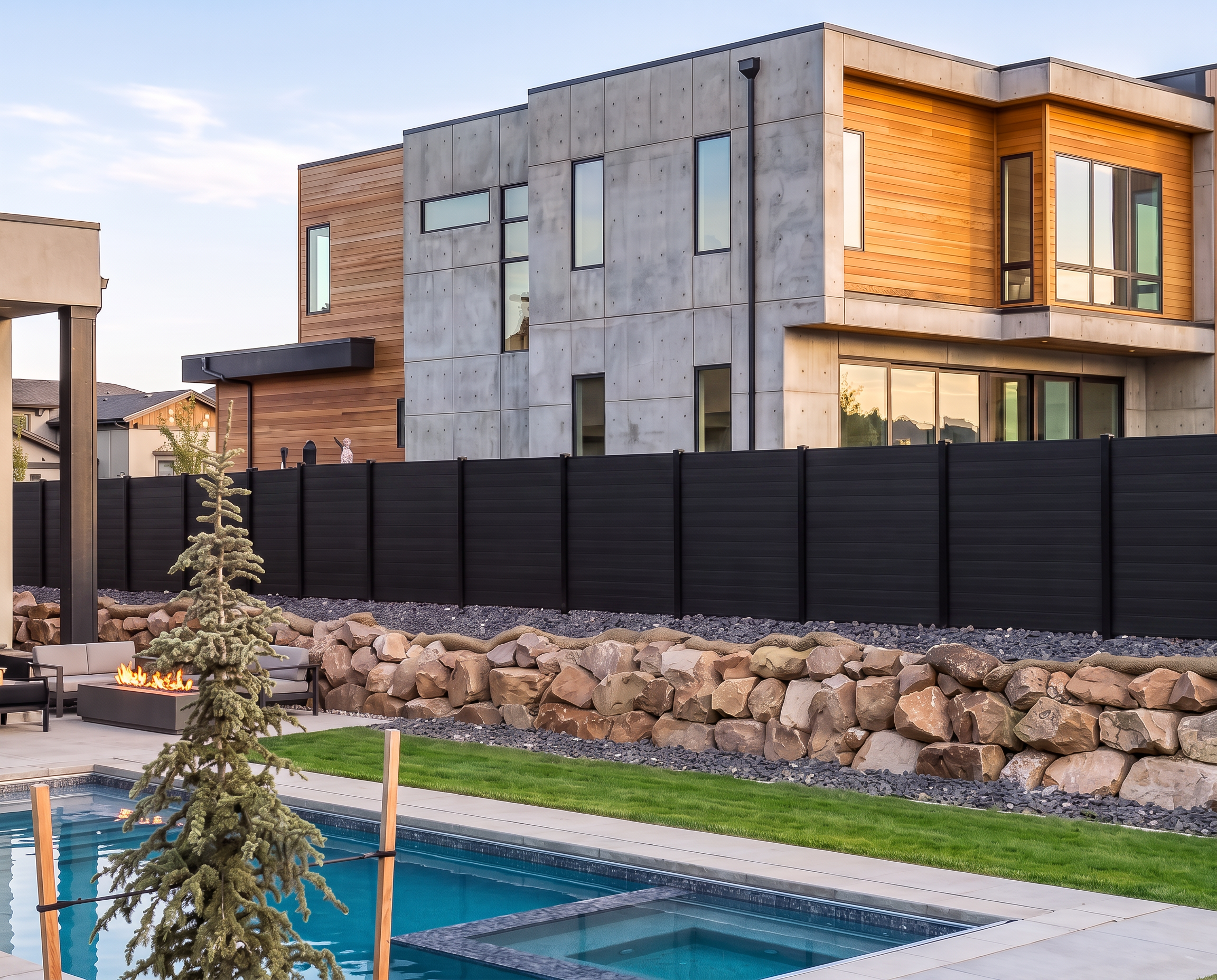 Shadow Forge Compoxen fence installed beside a modern home and pool